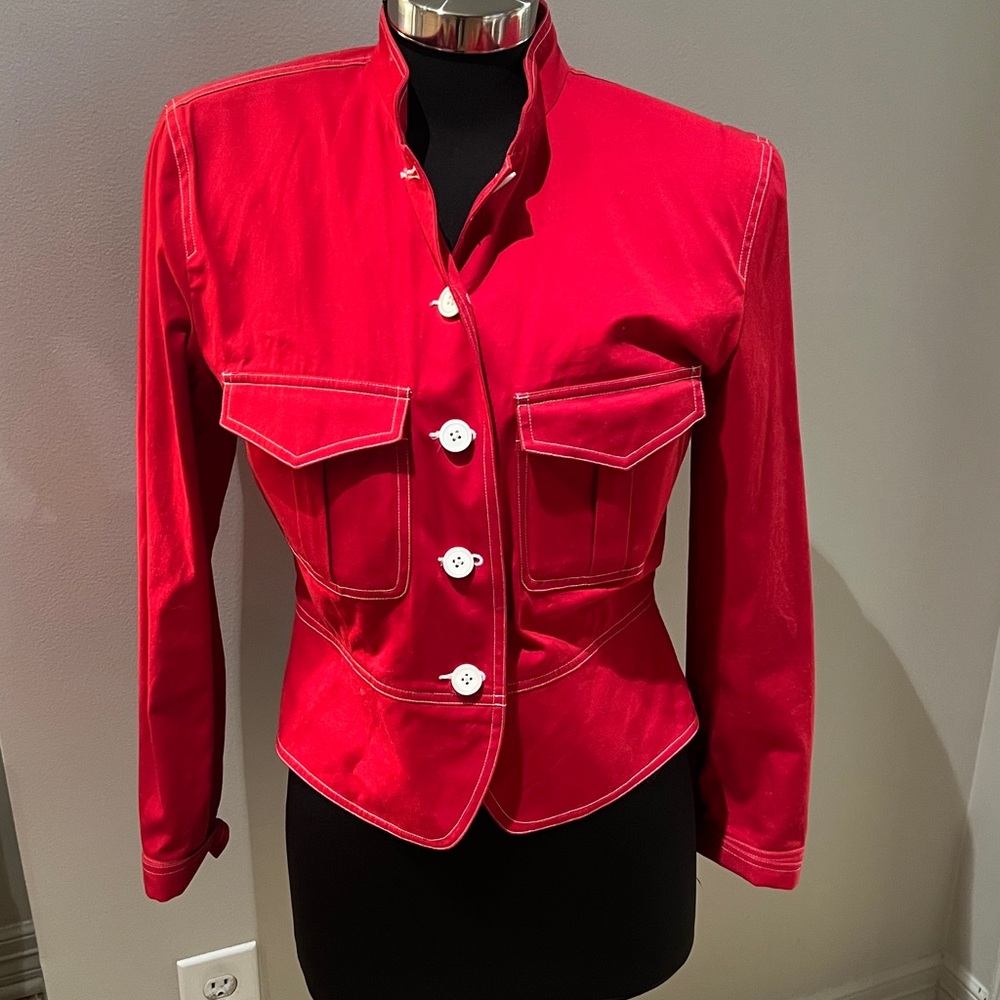 Red jacket in excellent condition. White buttons details  shoulder pads